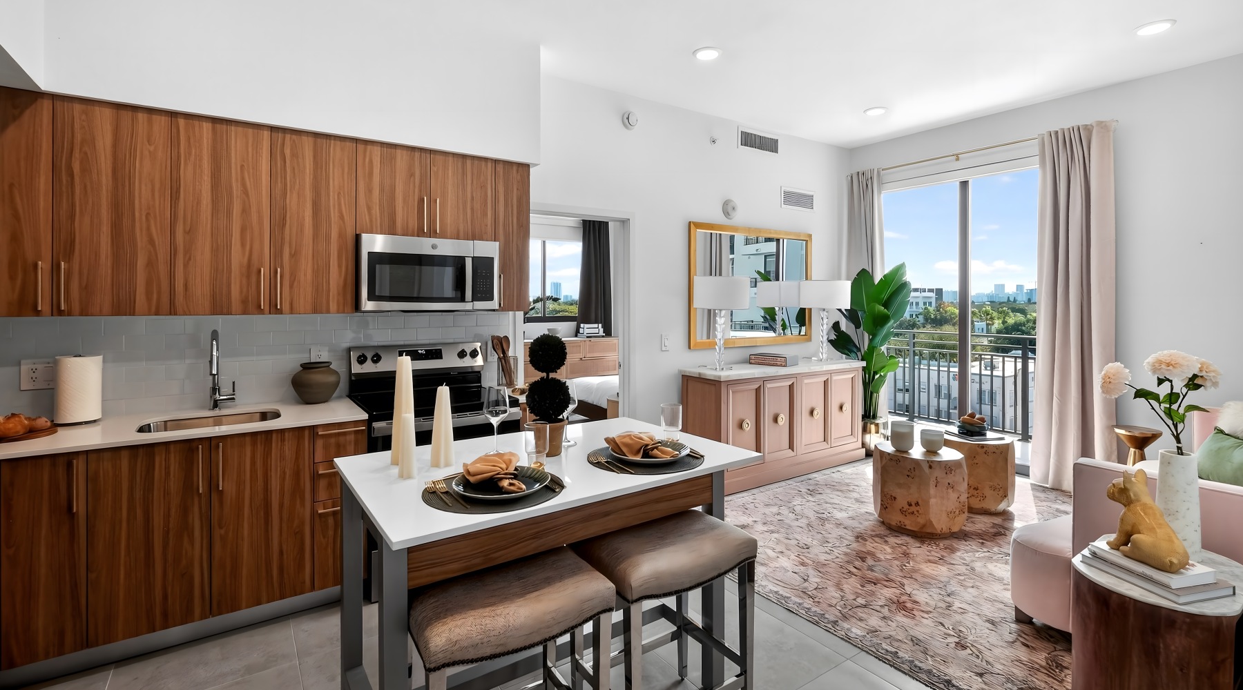 open-concept apartment with modern kitchen, dining table, and adjacent living area