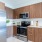 a kitchen with wooden cabinets