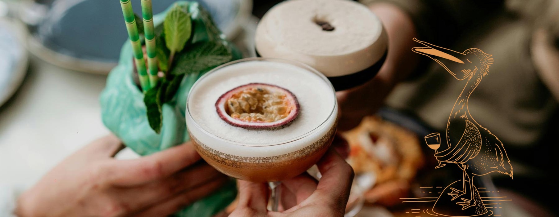 people holding cocktails