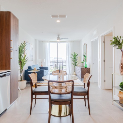 a kitchen with a dining table and chairs