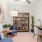 a living room with a table and chairs