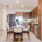 a kitchen with a dining table and chairs
