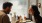 a man and a woman eating in a restaurant