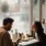 a man and a woman eating in a restaurant