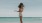 a woman standing on a beach