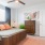a bedroom with a bed and a fan